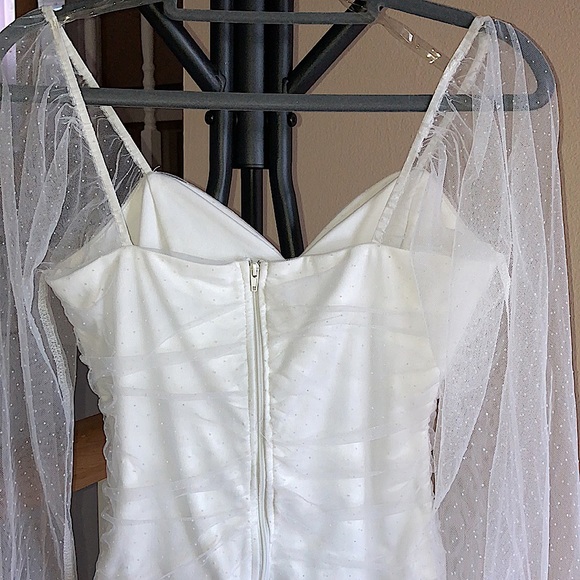 White bodysuit with dotted mesh sleeves. - Picture 5 of 5